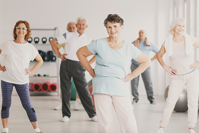 Senior older people doing a light exercise class to stay fit and healthy